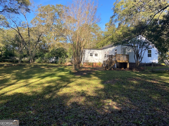 view of yard featuring a deck