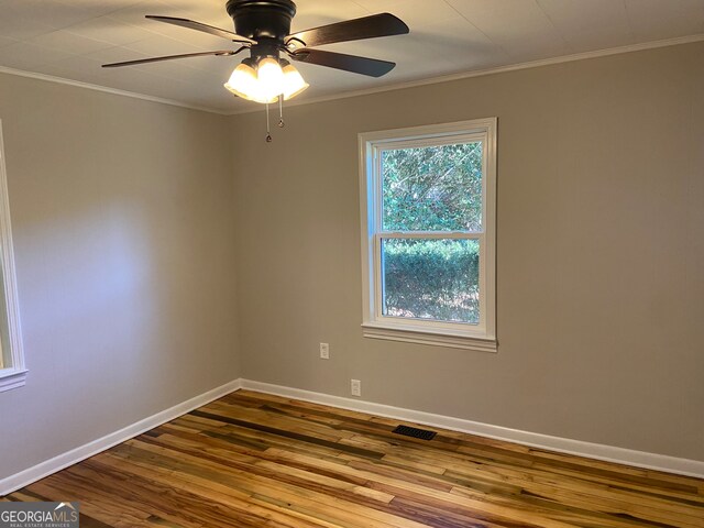 spare room with ornamental molding, hardwood / wood-style floors, and ceiling fan