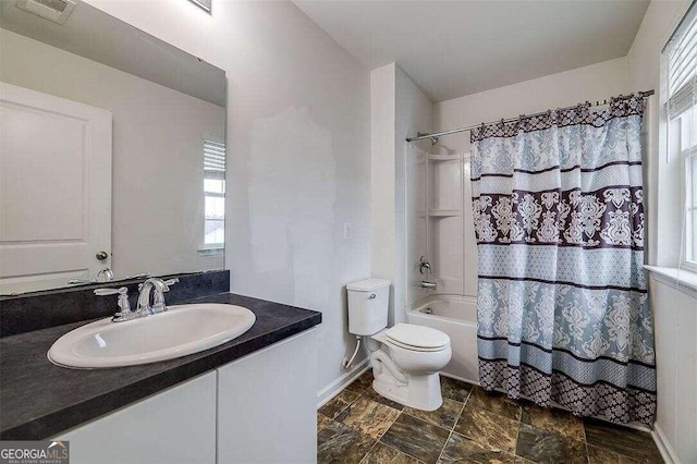 full bathroom featuring vanity, toilet, and shower / tub combo with curtain