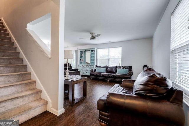 living room with ceiling fan and dark hardwood / wood-style floors