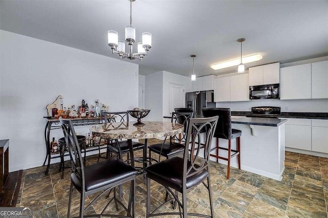 dining room featuring a notable chandelier