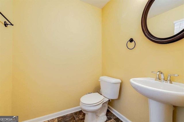 bathroom featuring sink and toilet