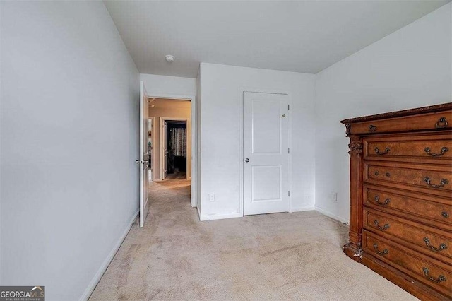 bedroom featuring light colored carpet