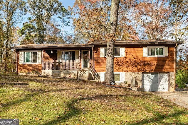 ranch-style house with a front lawn and a porch