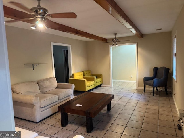 tiled living room featuring beamed ceiling and ceiling fan