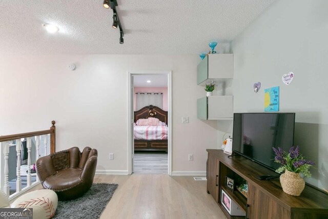 bedroom featuring light wood-type flooring and ceiling fan