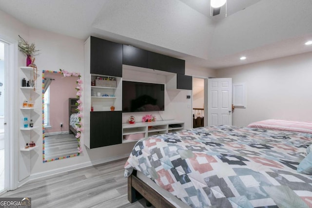 bedroom featuring light wood-type flooring and ceiling fan