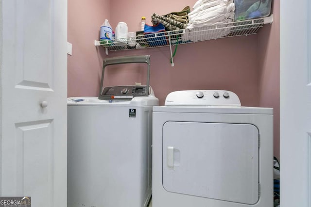 washroom with washer and dryer