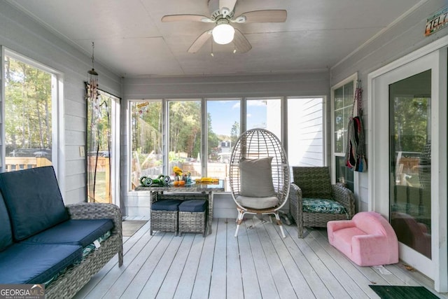 sunroom / solarium with ceiling fan