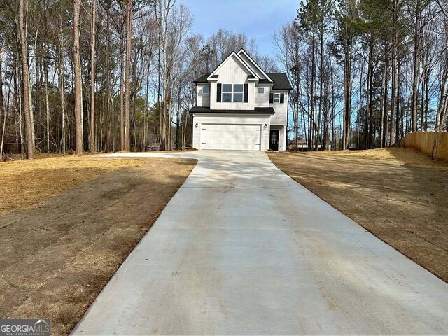 view of front facade featuring a garage, a front lawn, and central air condition unit