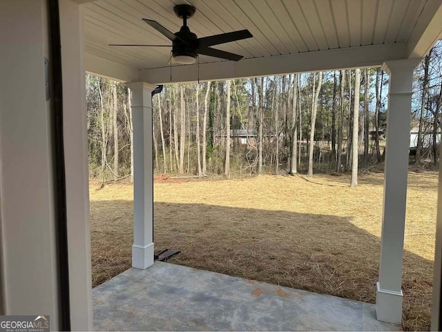 view of yard with a patio area and a ceiling fan