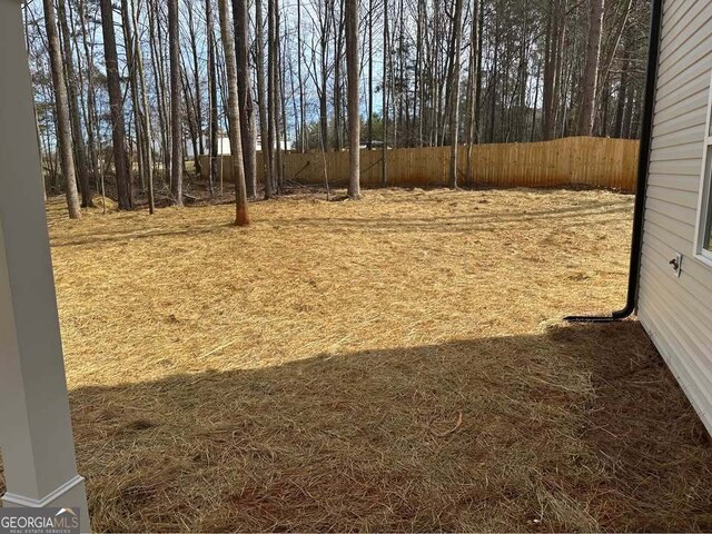 view of yard featuring fence