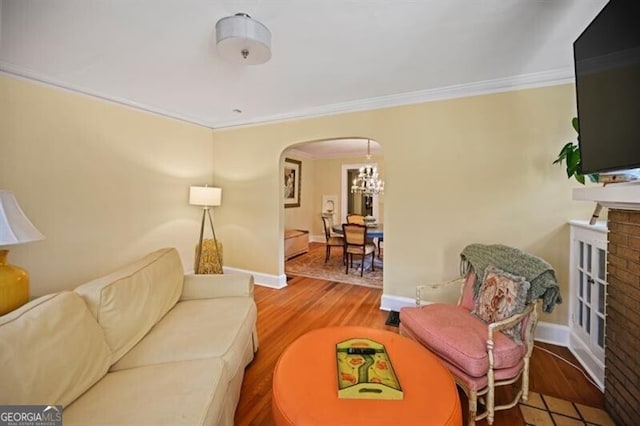 living room with hardwood / wood-style flooring and crown molding