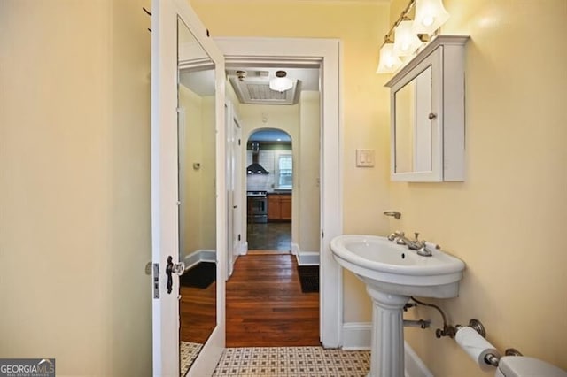 bathroom with wood-type flooring