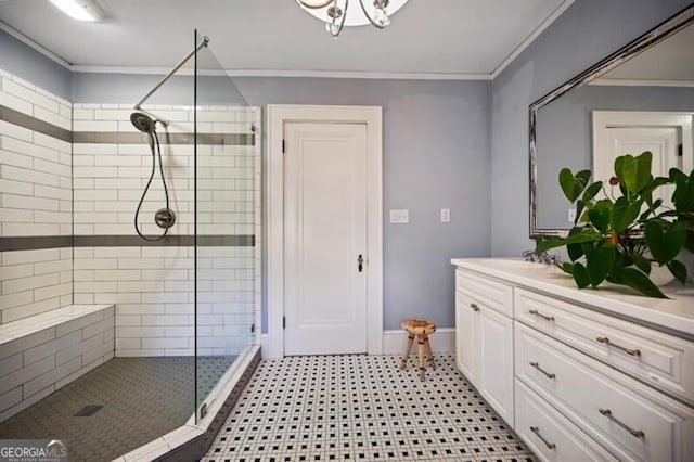 bathroom featuring vanity, crown molding, and a shower with shower door