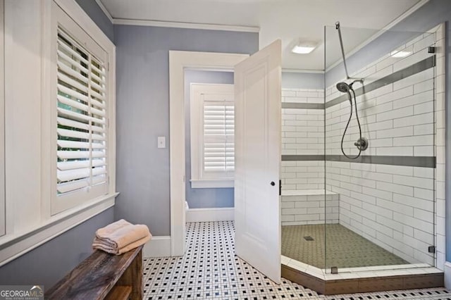 bathroom featuring ornamental molding and an enclosed shower