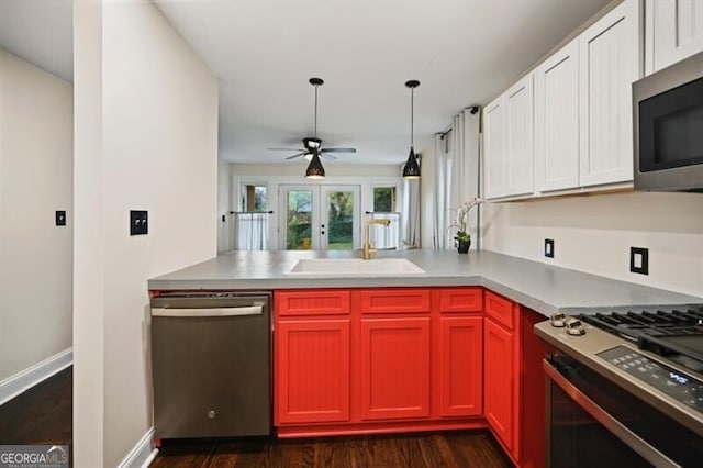 kitchen featuring white cabinetry, stainless steel appliances, dark hardwood / wood-style floors, and sink