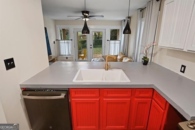 kitchen featuring sink, ceiling fan, french doors, stainless steel dishwasher, and kitchen peninsula