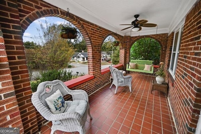 view of patio featuring ceiling fan and covered porch