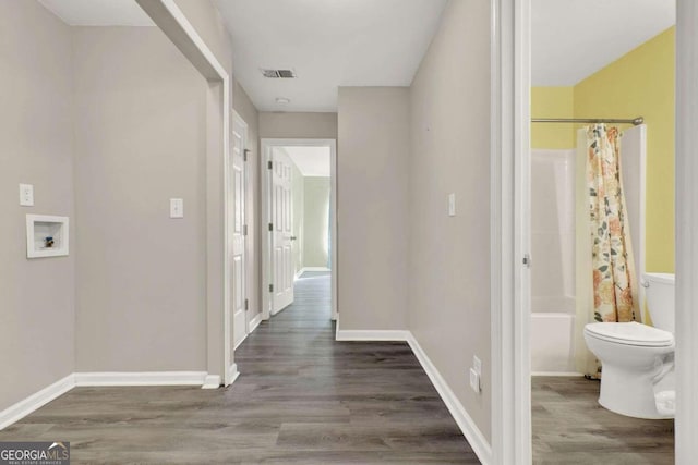 corridor featuring hardwood / wood-style flooring