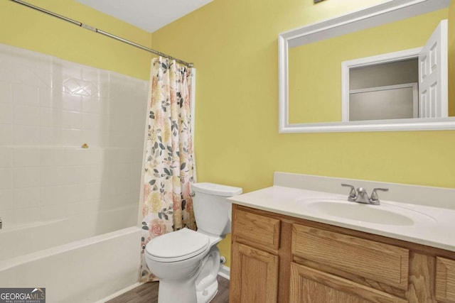 full bathroom featuring toilet, vanity, shower / bath combo with shower curtain, and hardwood / wood-style floors