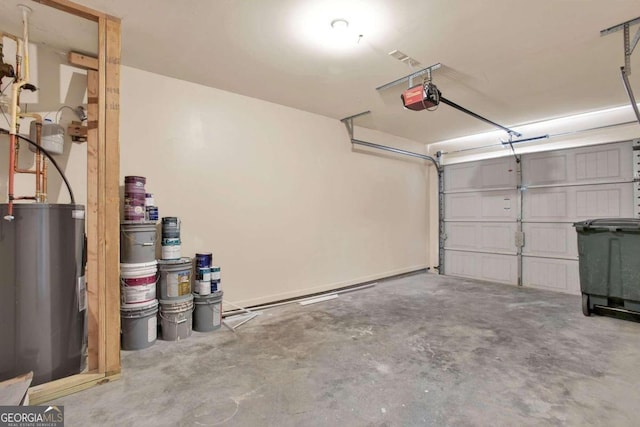 garage with electric water heater and a garage door opener