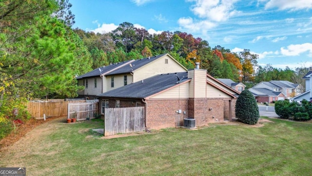 rear view of house with a lawn