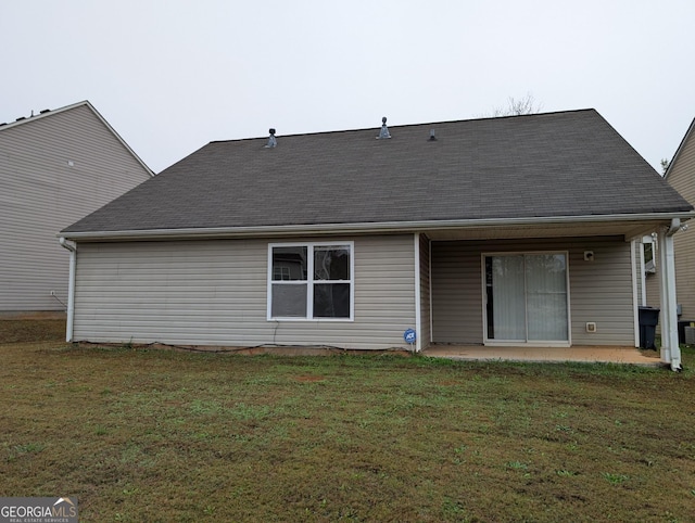 back of house featuring a yard and a patio area