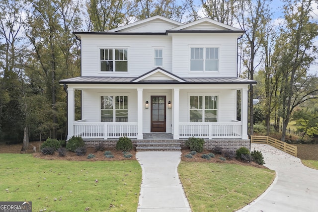 view of front of home with a front lawn and covered porch