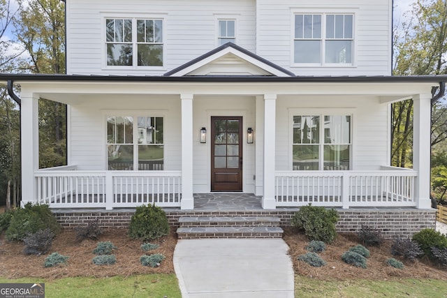 doorway to property with a porch