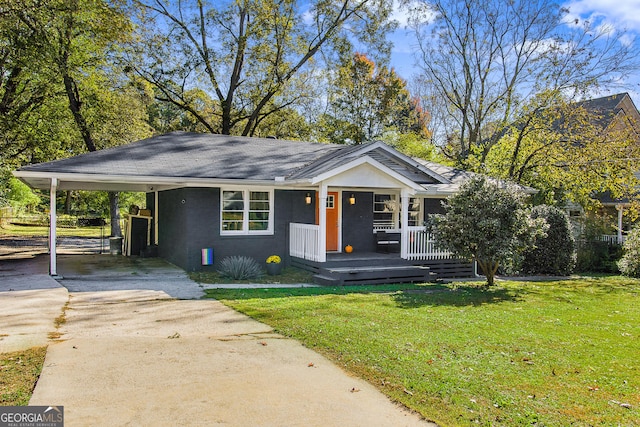 view of front of home with a carport, a porch, and a front lawn