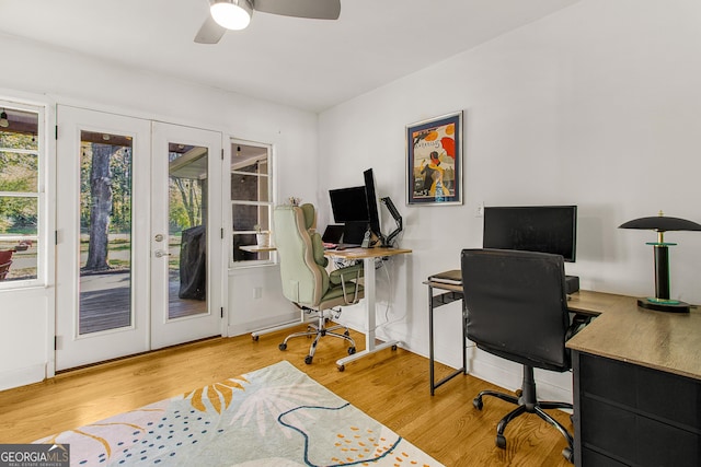 home office with ceiling fan, french doors, and hardwood / wood-style floors