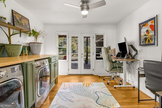 laundry room with washer and dryer, french doors, light wood-type flooring, and ceiling fan