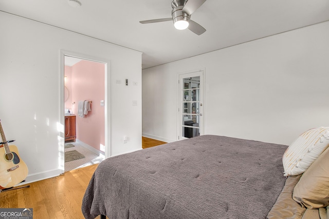 bedroom with hardwood / wood-style floors and ceiling fan