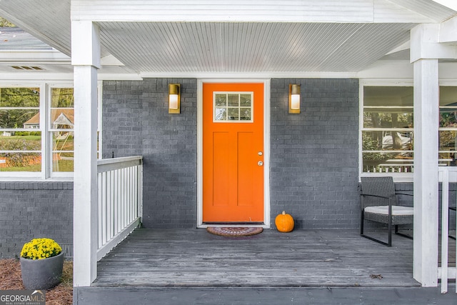 view of exterior entry featuring a porch