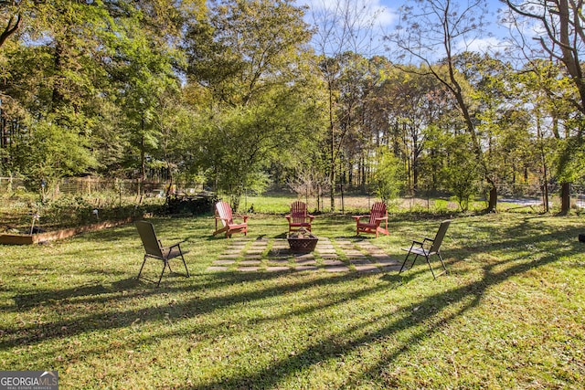 view of yard with a fire pit