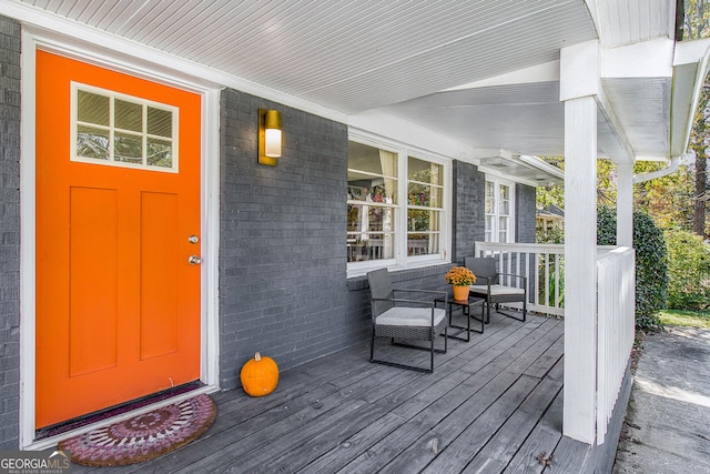 doorway to property featuring a porch