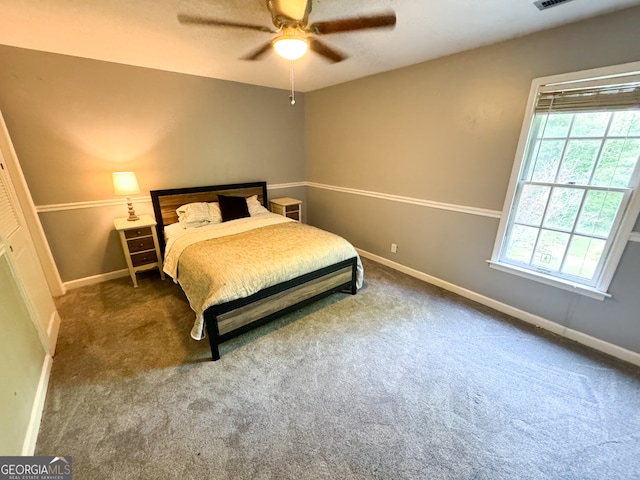 carpeted bedroom with ceiling fan