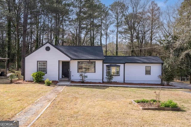 single story home with a front yard