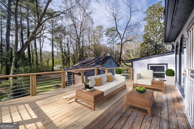 wooden terrace featuring outdoor lounge area