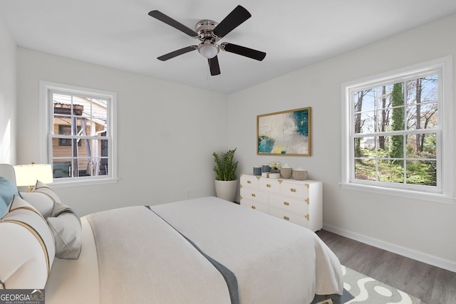 bedroom with hardwood / wood-style flooring and ceiling fan