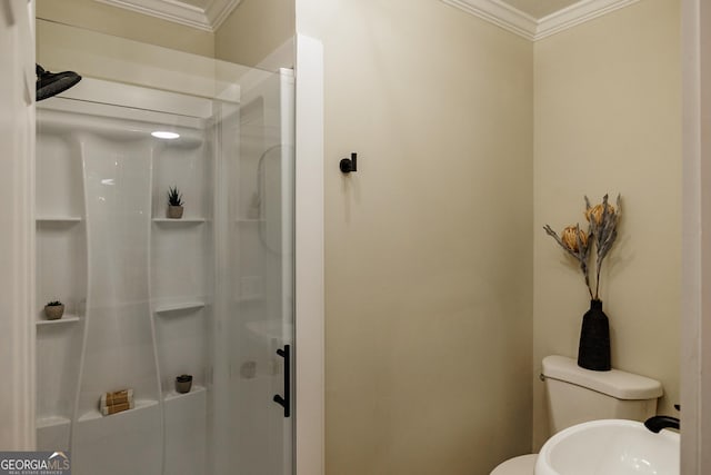 bathroom featuring toilet, crown molding, and walk in shower