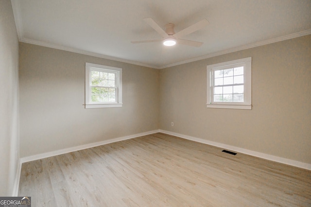 unfurnished room featuring ceiling fan, light hardwood / wood-style flooring, and ornamental molding