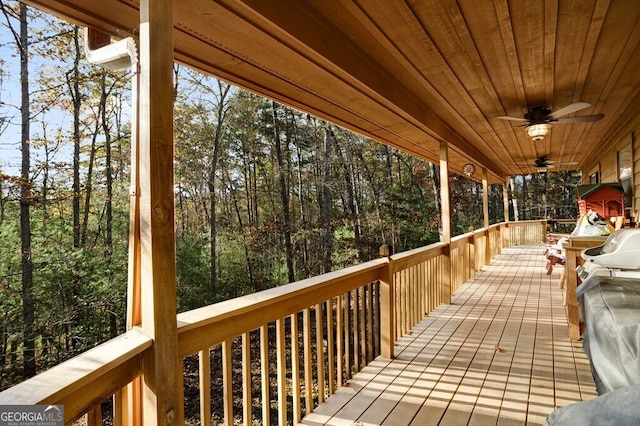 wooden deck featuring ceiling fan