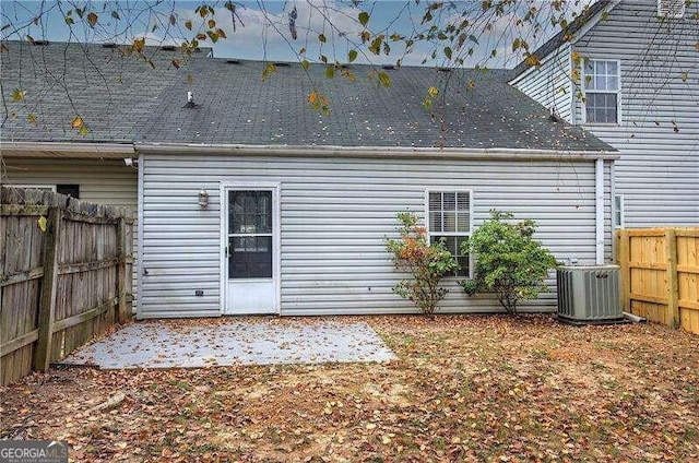 back of house featuring central AC unit and a patio area