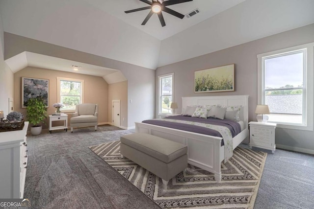 carpeted bedroom featuring lofted ceiling and ceiling fan