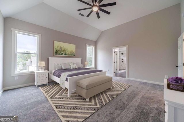 carpeted bedroom with multiple windows, ceiling fan, and vaulted ceiling