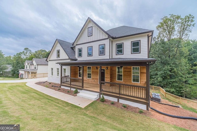 view of front of house featuring a front yard and a porch