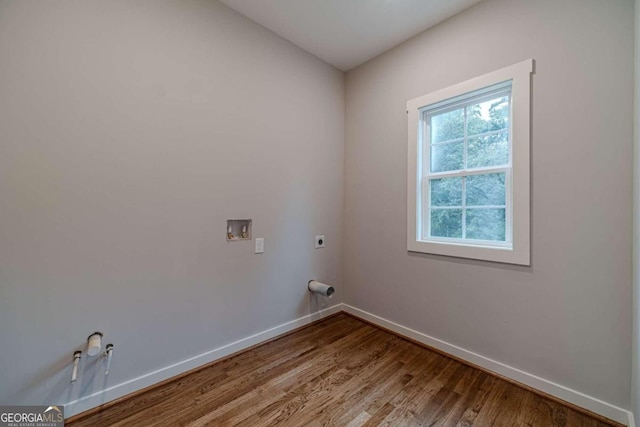 laundry area featuring hookup for a washing machine, electric dryer hookup, and hardwood / wood-style flooring