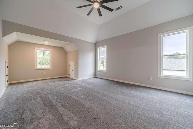 bonus room featuring carpet, lofted ceiling, and ceiling fan